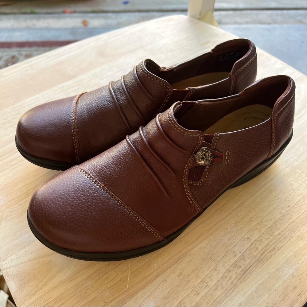 Clark’s brown leather loafers